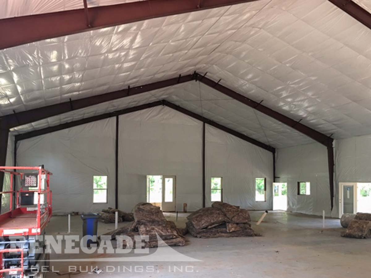 Insulation for metal building roof